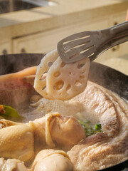 Marinated Lotus Root and Meat Hot Pot Cooking in Restaurant Kitchen