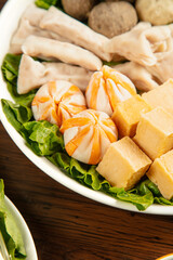 Hot Pot Ingredients with Enoki Mushrooms Tofu and Lamb for Asian Fondue Stew Cooking