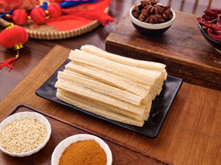 Fototapeta premium Traditional Chinese Dried Noodles with Spices and Red Decorations for Homemade Asian Cooking