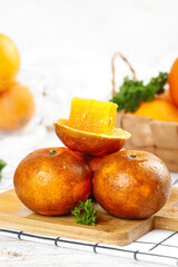 Fresh Orange Slices on Wooden Board with Parsley - Healthy Citrus Fruit Kitchen Preparation