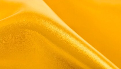 Smooth, golden fabric with soft folds and subtle sheen