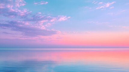 Obraz premium Serene sea reflecting pastel sky at dawn; soft colors, calm water, ethereal feeling
