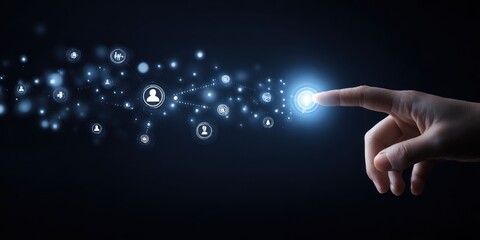 A hand touches a glowing circle with connected icons on a dark background, representing connection and digital interface. Focus on the bright light and finger