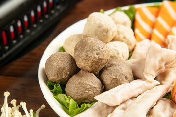 Hot Pot Meatballs with Tofu Strips and Fresh Vegetables in Bowl - Asian Cuisine