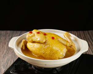 Nourishing Chinese Herbal Chicken Soup with Goji Berries in Traditional Bowl