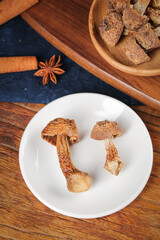 Dried Matsutake Mushrooms on White Plate with Star Anise Spice Raw Natural Ingredients Food Photography