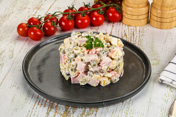 Russian traditional Olivier salad with sausages