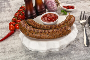 Grilled beef sausages with sauce