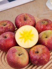 Fresh Red Apples with Star Pattern Cross Section on Wood Surface - Healthy Organic Fruit