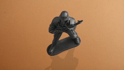 Little plastic toy army soldiers on background