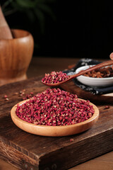 Dried Red Sichuan Dahongpao Peppercorns in Wooden Bowl - Chinese Cooking Spice Granules