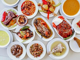 Delicious meat kebab with fresh vegetable salad served with variety of Turkish dishes and appetizers. Top view of assorted Turkish food and meze, tasty and healthy Mediterranean cuisine. Top view.