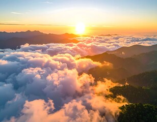 Obraz premium Serene Sunrise Over Misty Mountains and Clouds at Dawn