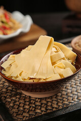 Fresh Handmade Tofu Skin Sheets in Bowl - Traditional Asian Soy Product Ingredient