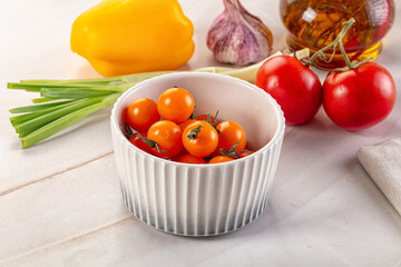 Ripe juicy yellow cherry tomato