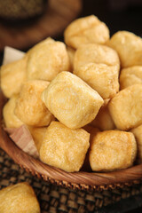 Golden Fried Tofu Cubes in Bamboo Basket - Traditional Asian Food Preparation