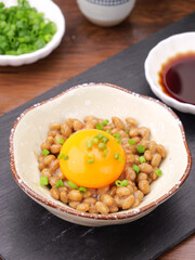 Japanese Natto with Raw Egg Yolk and Green Onions in Traditional Bowl - Fermented Soybean Dish
