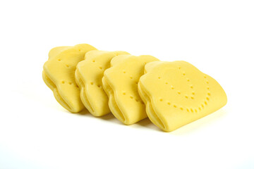 Yellow Lotus Shaped Traditional Sandwich Cookies or Cakes in Row on White Background
