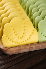 Traditional Two-Color Lotus Leaf Steamed Buns on Bamboo Tray - Asian Handmade Cuisine