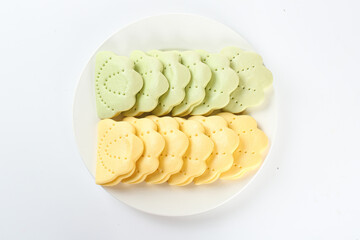 Bicolor Lotus Leaf Shaped Crackers on White Plate - Handmade Green Yellow Snacks