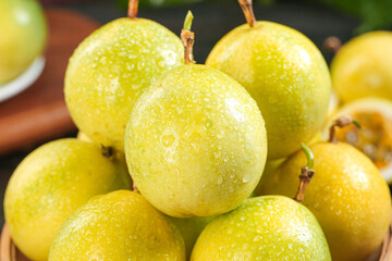 Fresh Yellow Passion Fruits with Water Droplets in Wooden Bowl - Tropical Exotic Fruit Display