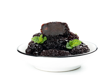 Dried Black Jujube Fruits from Xinjiang China with Mint in White Bowl