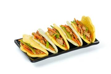 Asian Steamed Buns with Shredded Pork and Vegetables on Black Serving Tray