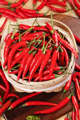 Fresh Red Chili Peppers in Wicker Basket - Spicy Hot Cooking Ingredients