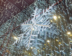 A snowflake is hanging from the ceiling