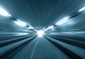 Abstract blur image of a tunnel or corridor with a bright light at the end, conveying speed and motion. High contrast and blue-toned hues are used