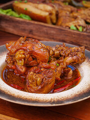 Marinated Meat Rolls in Savory Sauce - Traditional Cooked Comfort Food Dish on Rustic Plate