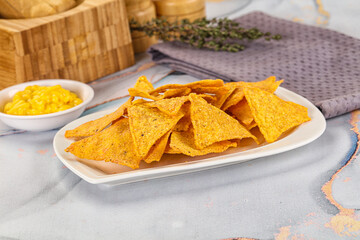 Corn nachos chips with cheese dip