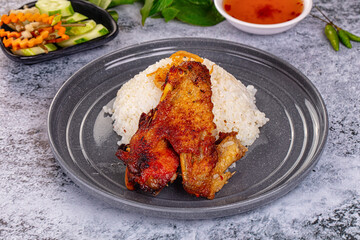 Spicy roasted chicken wing with rice