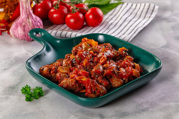 Roasted chicken hearts with vegetables