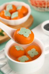 Traditional Persimmon Dumplings with Leaf Design in White Bowls - Gourmet Asian Festival Food
