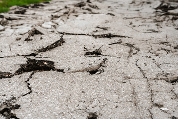 Raised destroyed asphalt, pieces of concrete