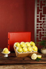 Fresh Yellow Guava Fruits in Gift Box Set with Traditional Red Asian Background Decor
