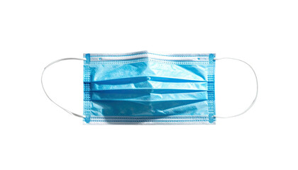 Light-blue disposable face mask, top view, isolated on black