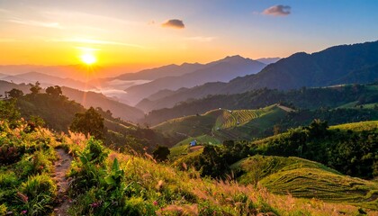 Scenic vista capturing a sunrise over layered, rolling hills. The light bathes the landscape in warmth, grass in foreground