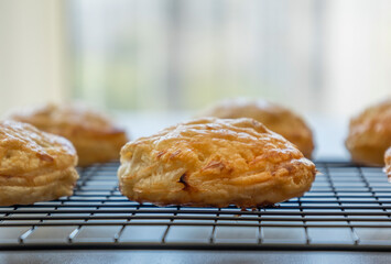 golden puff pastry bites filled with creamy brie cheese and fresh apple slices