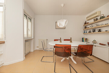 Modern dining space with a rectangular glass table and chrome-plated steel chairs, ideal for contemporary interiors