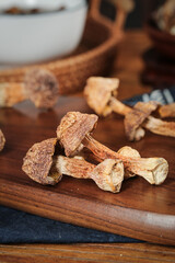 Dried Shiitake Mushrooms on Wooden Cutting Board - Gourmet Asian Cooking Ingredients