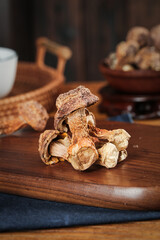 Dried shiitake mushrooms on wooden cutting board - Asian cooking ingredients