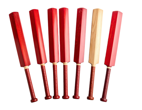 Eight miniature wooden cricket bats; seven red, one natural wood; arranged in a semi-circle, showcasing variation in wood tones