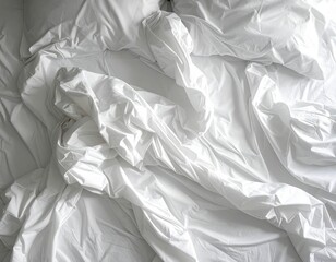Wrinkled white sheets on a bed