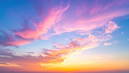 Fototapeta premium Vibrant skyscape painting with pink and yellow tinted clouds against a gradient of blue. Abstract, colorful, and serene atmosphere