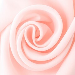 Soft, light pink fabric folds in a spiral