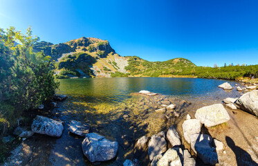 Fototapeta premium lake, water, landscape, nature, mountain, sky, river, summer, sea, mountains, clouds, travel, park, rock, view, green, coast, grass, rocks, reflection, north, scenery, national, tourism, blue