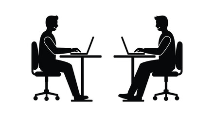 Two individuals working on laptops at desks facing each other