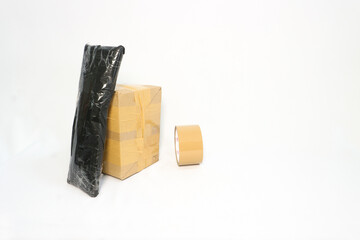 cardboard and plastic package wrapped with brown tape isolated on white background